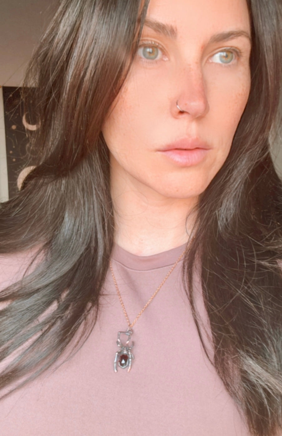 Real black widow with garnet necklace