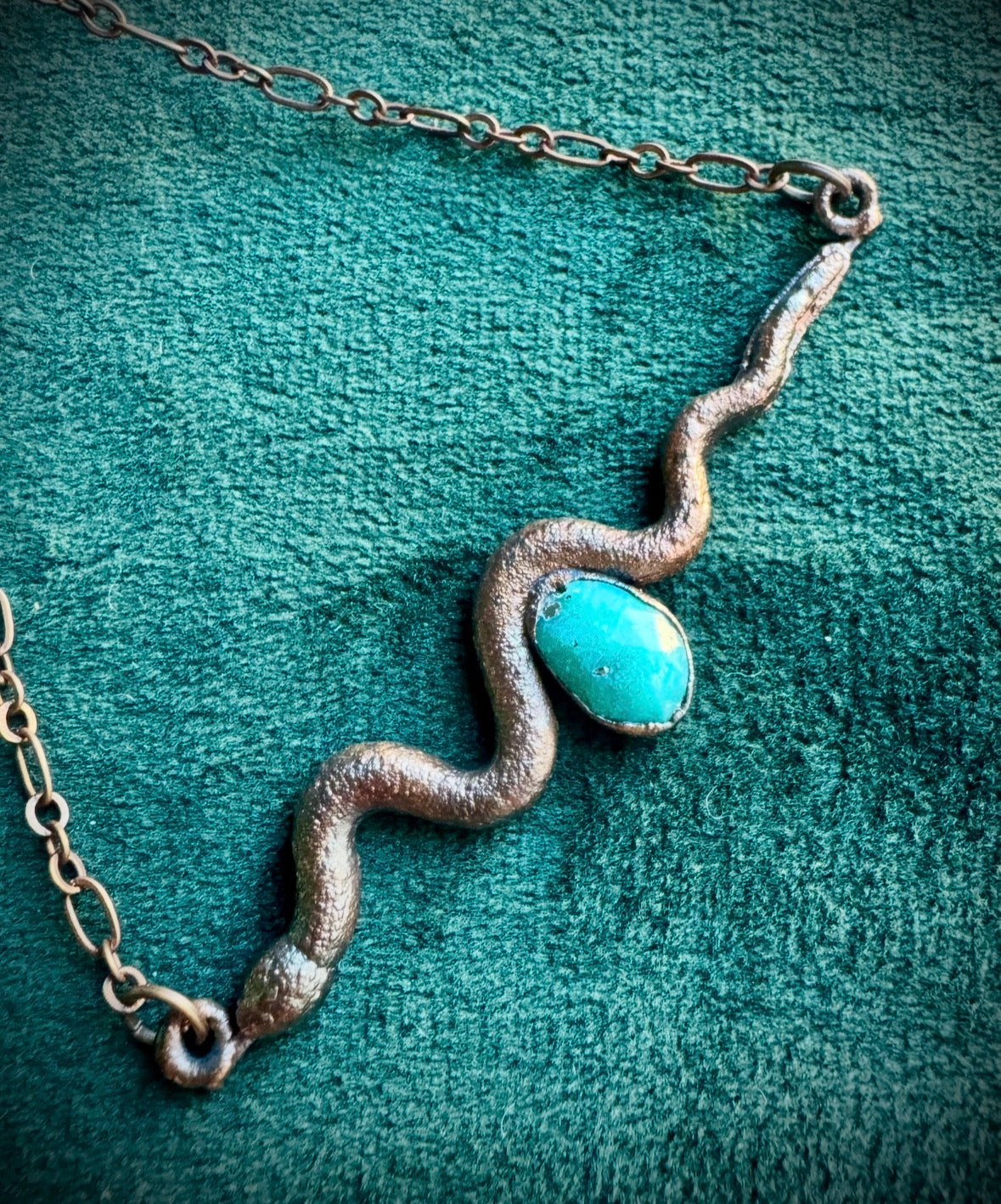 Turquoise stone and snake.