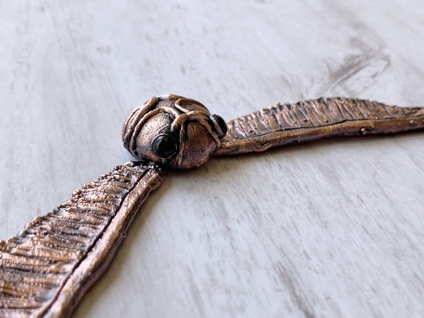 “Golden snitch” necklace