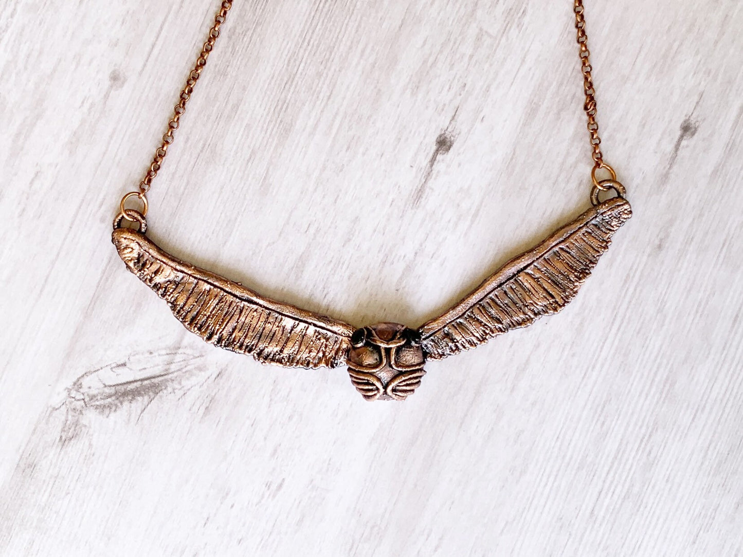 “Golden snitch” necklace